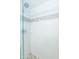 Tiled shower with glass doors and decorative accent tiles at 7970 E Camelback Rd # 604, Scottsdale, AZ 85251