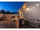 Resort-style backyard featuring a built-in grill and boulder landscaping, perfect for outdoor entertaining at 8214 N 16Th St, Phoenix, AZ 85020