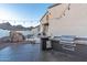 Outdoor kitchen area with a built-in grill, and a tranquil view of the pool and surrounding mountains at 8214 N 16Th St, Phoenix, AZ 85020