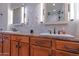 Bathroom with double sinks, granite countertop, and white marble backsplash at 8214 N 16Th St, Phoenix, AZ 85020