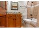 Bathroom featuring a vanity with granite countertop, toilet, and shower/tub combo at 8214 N 16Th St, Phoenix, AZ 85020