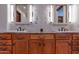 Bathroom featuring double sinks, granite countertop, and two mirrors at 8214 N 16Th St, Phoenix, AZ 85020