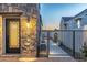 Stone accented home entrance with wrought iron gate and door, exudes elegance and security at 8214 N 16Th St, Phoenix, AZ 85020