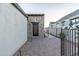 Charming home entrance with stone accents, metal gate, and brick paved walkway at 8214 N 16Th St, Phoenix, AZ 85020