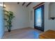 Charming entryway featuring a decorative glass door, inset shelving, and wood-look flooring at 8214 N 16Th St, Phoenix, AZ 85020