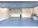 Clean garage featuring overhead storage and epoxy floor at 8214 N 16Th St, Phoenix, AZ 85020