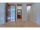 Hallway featuring hardwood floors, white walls, and multiple doorways at 8214 N 16Th St, Phoenix, AZ 85020