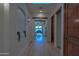Inviting hallway with recessed lighting, wood floors, a decorative alcove, and views into other rooms at 8214 N 16Th St, Phoenix, AZ 85020