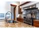 Gourmet kitchen featuring stainless steel appliances, custom cabinetry, stone countertops, and decorative tile backsplash at 8214 N 16Th St, Phoenix, AZ 85020