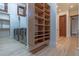 Well-lit laundry room with modern washer/dryer units, shelves, and hardwood floors at 8214 N 16Th St, Phoenix, AZ 85020