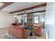Cozy living room features wood beams, stone fireplace, and comfortable seating arrangement at 8214 N 16Th St, Phoenix, AZ 85020