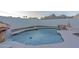 The backyard includes a custom pool with a tranquil waterfall feature, rocks, and mountain views at 8214 N 16Th St, Phoenix, AZ 85020