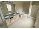 Full bathroom with double vanity, soaking tub, and walk-in shower at 9456 W Jamestown Rd, Phoenix, AZ 85037