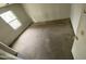 A small, sparsely furnished bedroom with a window at 9456 W Jamestown Rd, Phoenix, AZ 85037