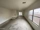 Spacious living room with ample natural light from the large windows at 9456 W Jamestown Rd, Phoenix, AZ 85037