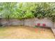 A view of the backyard shows a small grassy area with a wooden bench at 10601 N 36Th St, Phoenix, AZ 85028