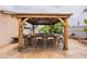 Covered outdoor kitchen with built-in bar and seating at 10601 N 36Th St, Phoenix, AZ 85028