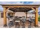 Outdoor kitchen features built-in bar and overhead beams at 10601 N 36Th St, Phoenix, AZ 85028