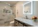 Stylish bathroom features a glass enclosed shower and updated vanity at 10601 N 36Th St, Phoenix, AZ 85028