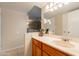 Bathroom vanity has cabinet storage below the sink and a mirrored medicine cabinet at 10601 N 36Th St, Phoenix, AZ 85028