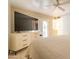 Bright bedroom with tile floors and door to outside patio at 10601 N 36Th St, Phoenix, AZ 85028