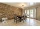Stylish dining room with a stone accent wall, perfect for entertaining guests at 10601 N 36Th St, Phoenix, AZ 85028