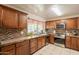 Traditional kitchen boasts stainless steel appliances and tile backsplash at 10601 N 36Th St, Phoenix, AZ 85028