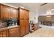 Open kitchen featuring custom cabinetry, granite counters, and breakfast bar at 10601 N 36Th St, Phoenix, AZ 85028