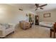 Spacious living room featuring tile flooring, comfortable seating, and natural light at 10601 N 36Th St, Phoenix, AZ 85028