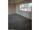 Bedroom featuring a window with views of the outdoors and a ceiling fan at 1128 E Malibu E Dr, Tempe, AZ 85282