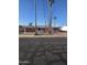 Charming single-story home with mature palm trees and a neatly maintained front yard at 1128 E Malibu E Dr, Tempe, AZ 85282