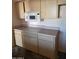 Kitchen featuring a microwave, cooktop, and plenty of cabinet space at 1128 E Malibu E Dr, Tempe, AZ 85282