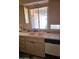 Kitchen sink with cabinets and a window overlooking the backyard at 1128 E Malibu E Dr, Tempe, AZ 85282