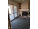 Living room with a fireplace and sliding glass doors to the outside at 1128 E Malibu E Dr, Tempe, AZ 85282