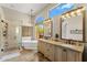 Luxurious bathroom featuring a freestanding tub, walk-in shower, and dual vanities at 11324 E Diamond Cholla Dr, Scottsdale, AZ 85255
