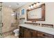 Bathroom featuring walk-in shower, modern vanity, and decorative wall mirror at 11324 E Diamond Cholla Dr, Scottsdale, AZ 85255