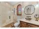 Bathroom featuring a stand up shower, unique vessel sink, and shuttered window at 11324 E Diamond Cholla Dr, Scottsdale, AZ 85255