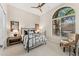 Bedroom featuring a metal bed frame, neutral walls, and a large window with natural light at 11324 E Diamond Cholla Dr, Scottsdale, AZ 85255