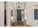 Elegant foyer with hardwood floors, stylish lighting, and a decorative rug at 11324 E Diamond Cholla Dr, Scottsdale, AZ 85255