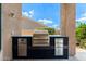 Modern outdoor kitchen setup with built-in BBQ, perfect for entertaining in style at 11324 E Diamond Cholla Dr, Scottsdale, AZ 85255