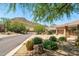 Charming home featuring desert landscaping, set against a backdrop of scenic mountains at 11324 E Diamond Cholla Dr, Scottsdale, AZ 85255