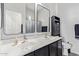 Bathroom featuring a double sink vanity with modern fixtures and ample storage space at 11957 W Daley Ln, Sun City, AZ 85373