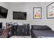 Bedroom with black dresser, Star Wars decor, and a comfortable bed with dark bedding at 11957 W Daley Ln, Sun City, AZ 85373