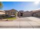 Charming single-story home featuring a three-car garage and low maintenance desert landscaping at 11957 W Daley Ln, Sun City, AZ 85373