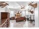 Elegant main bedroom showcasing hardwood furniture and decor at 11957 W Daley Ln, Sun City, AZ 85373