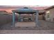 Outdoor kitchen with a built-in grill and ample counter space at 11957 W Daley Ln, Sun City, AZ 85373