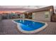 Backyard pool with patio area, perfect for outdoor entertaining at 11957 W Daley Ln, Sun City, AZ 85373