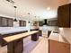 Spacious kitchen featuring an island, custom cabinetry, and modern appliances at 12230 N 47Th Dr, Glendale, AZ 85304