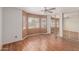 Bright bedroom with a ceiling fan, mirrored closets, and a cozy bay window area at 12425 W Willow Ave Ave, El Mirage, AZ 85335