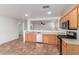 Bright kitchen featuring stainless steel appliances and breakfast bar that opens up to the living area at 12425 W Willow Ave Ave, El Mirage, AZ 85335
